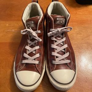Brown leather converse